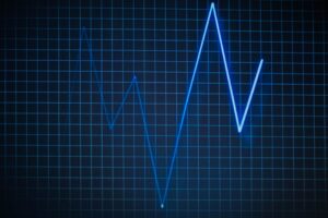 ECG graph on a grid background symbolizing heartbeat and medical data.
