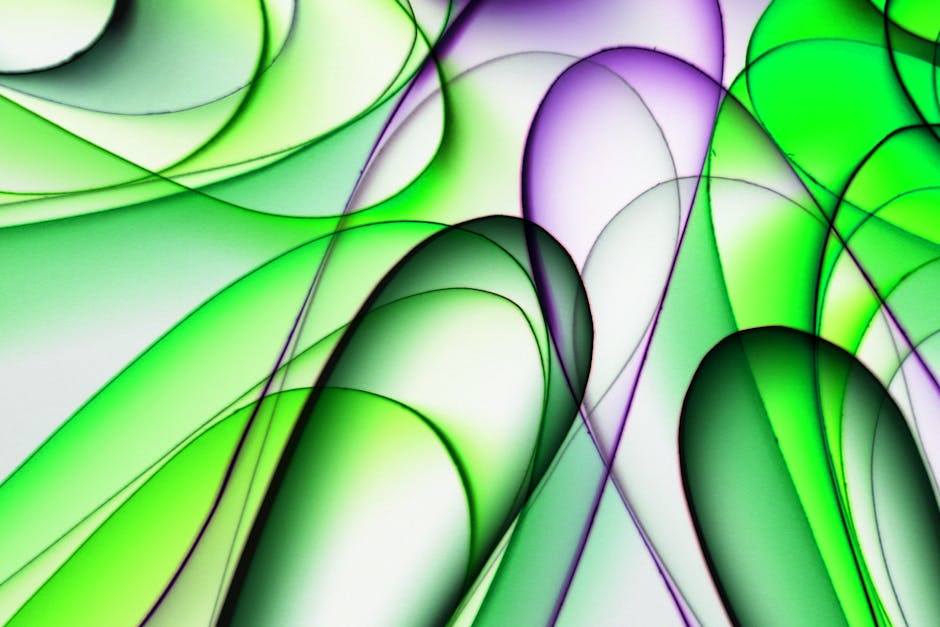 Dynamic abstract art with green and purple curves, conveying fluid motion and energy.
