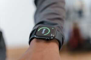 A modern smartwatch displays a "Ready" status on a person's wrist in focus.