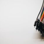 Close-up of colorful electronic jumper wires on a white background.